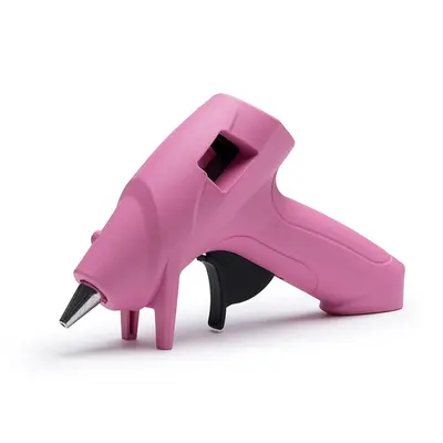 Pink hot melt glue pistol with a metal glue gun nozzle
